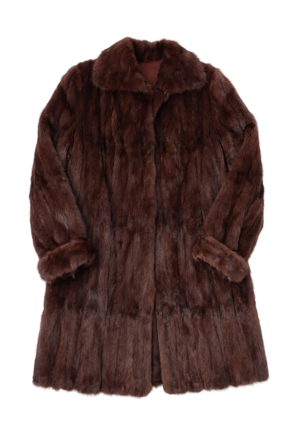 Brown fur coat on a white background