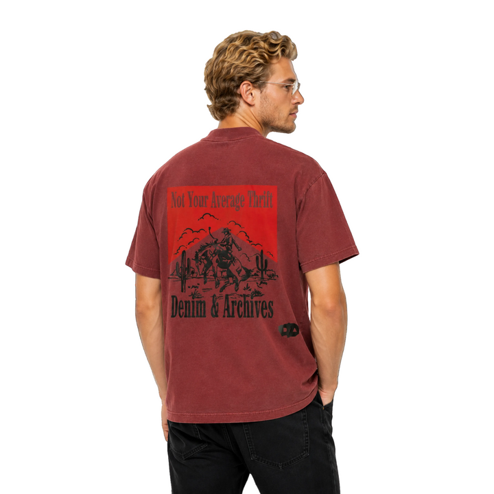 Man wearing a maroon t-shirt with a graphic design on the back, standing against a white background.