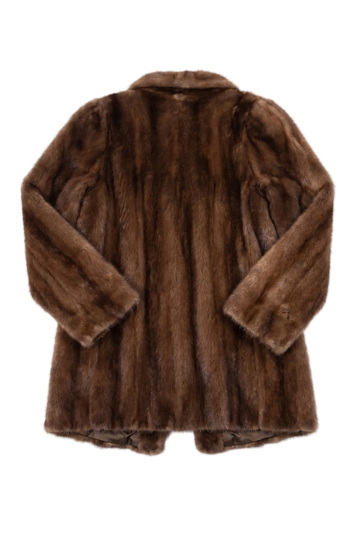 Brown fur coat on a white background