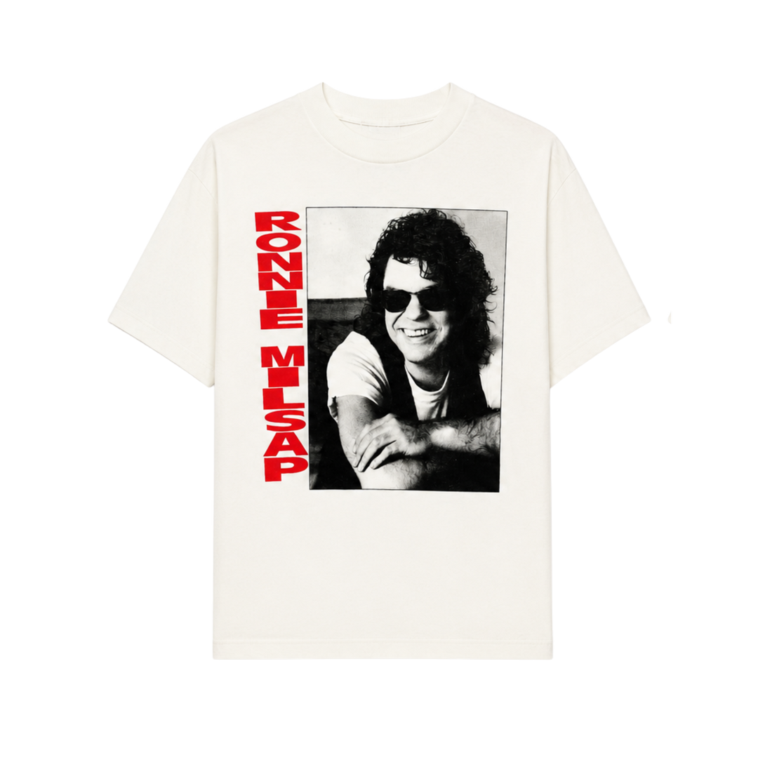 White t-shirt with a black and white photo of a person and red text on a white background