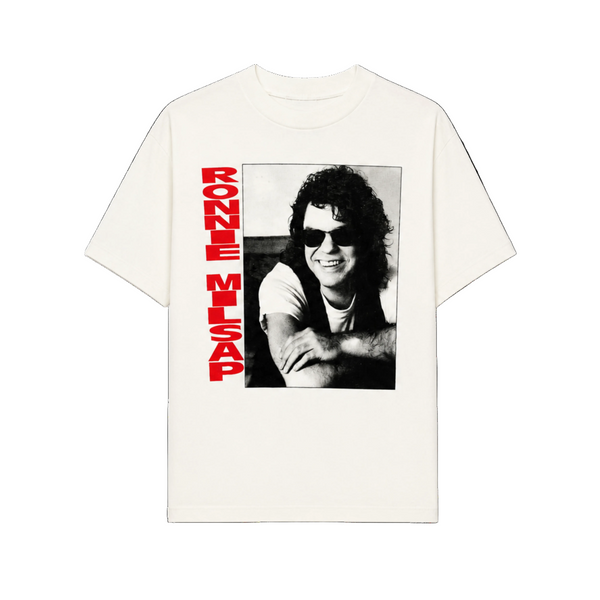 White t-shirt with a black and white photo of a person and red text on a white background