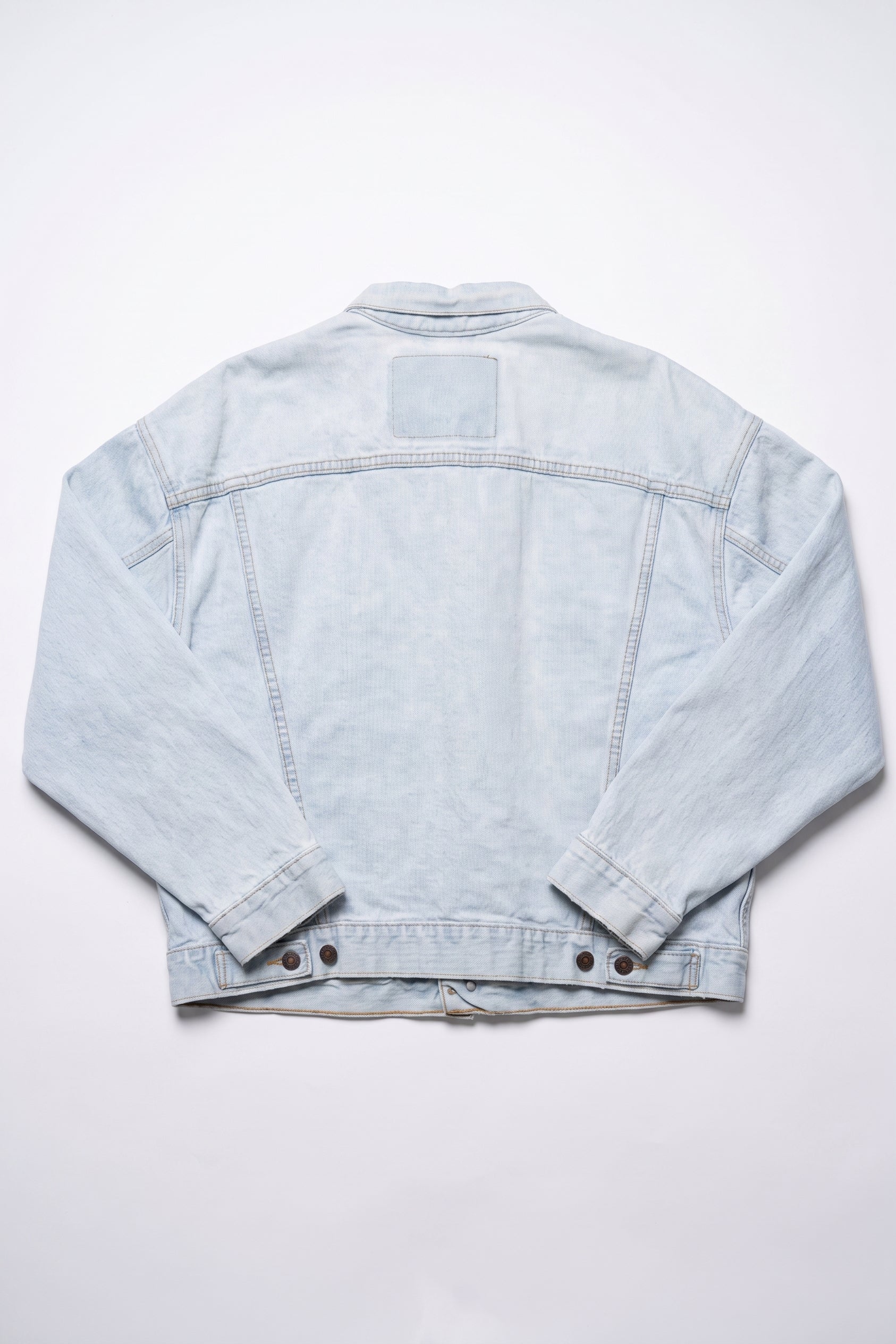 Light blue denim jacket on a white background
