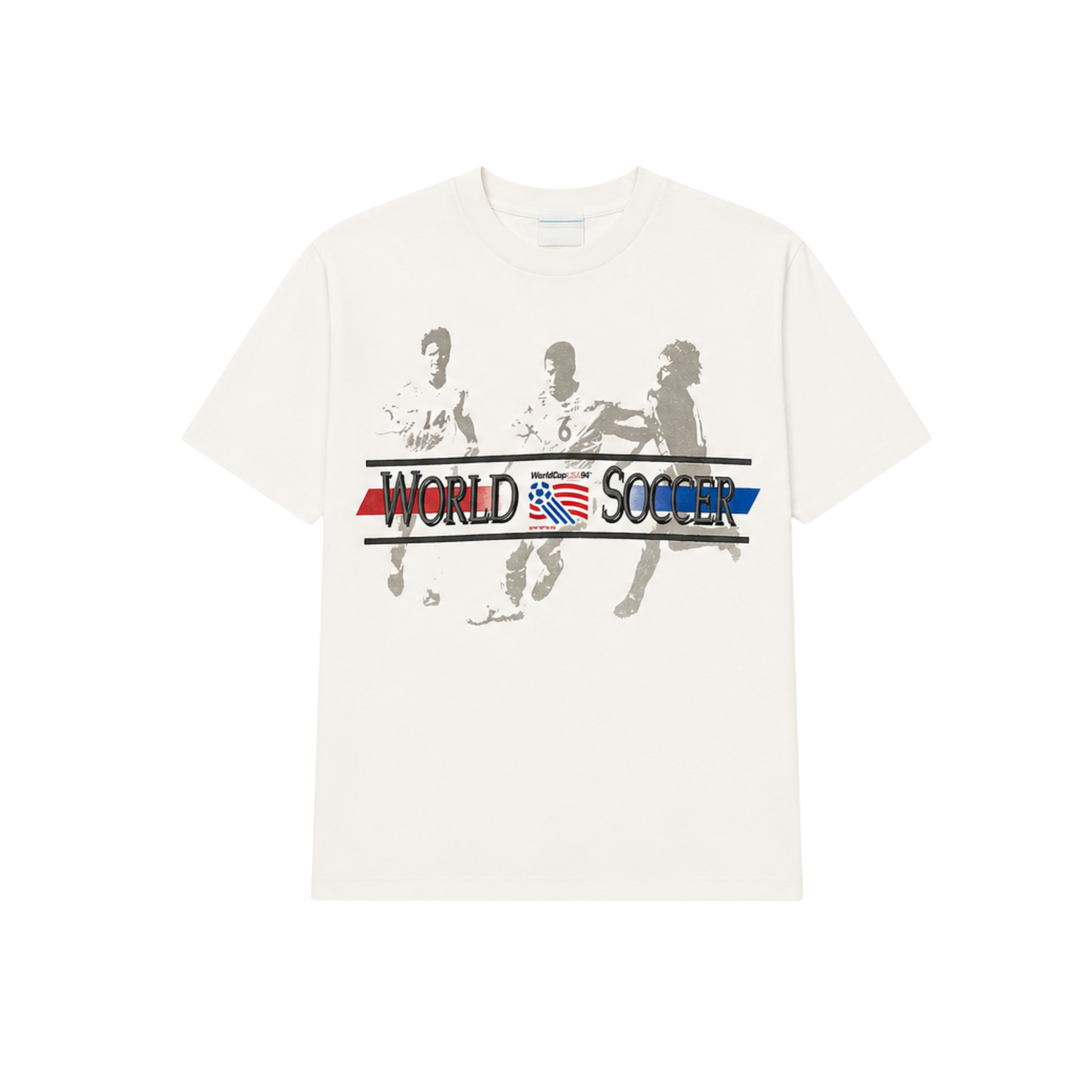 White t-shirt with soccer-themed graphic and text on a white background