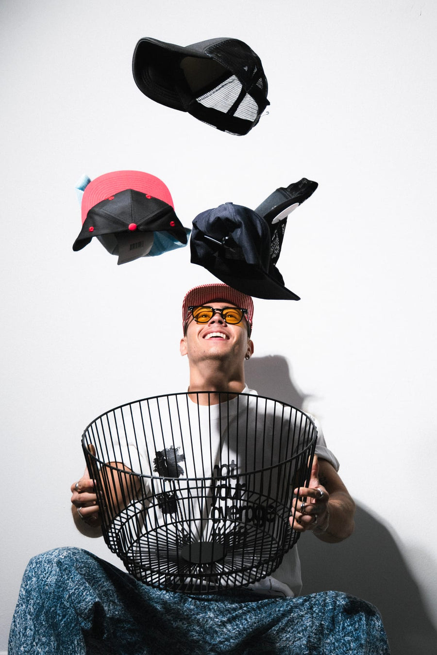 Caps flying out of a wire basket