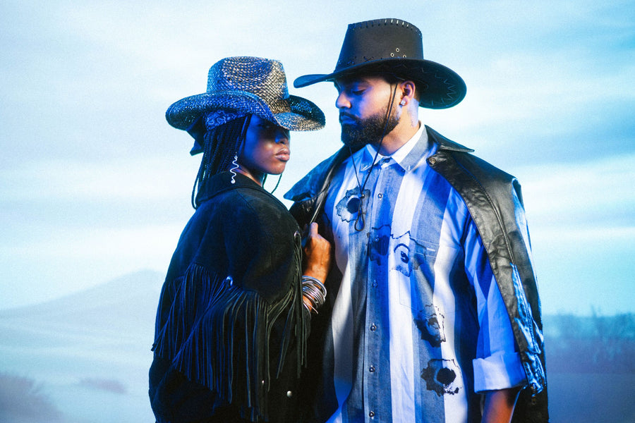 Two friends in cowboy hats, fringe suede and a leather jacket